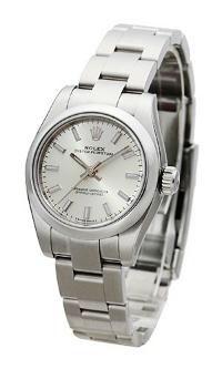 Rolex Oyster Perpetual 26 mit silbernem Zifferblatt fuer Damen